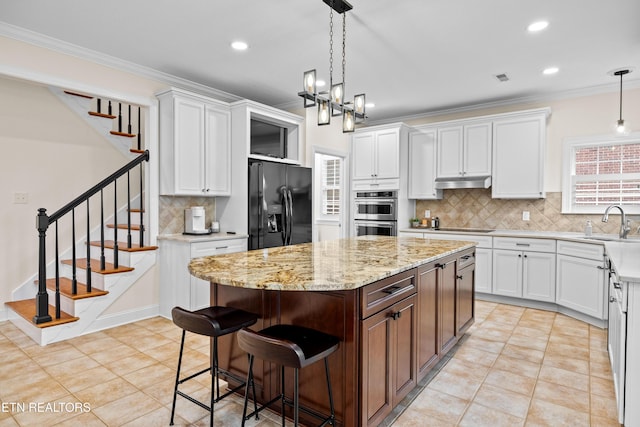12618 Hunters Creek Ln, Knoxville, TN 37922 - kitchen featuring black appliances, under cabinet range hood, white cabinets, backsplash, and recessed lighting