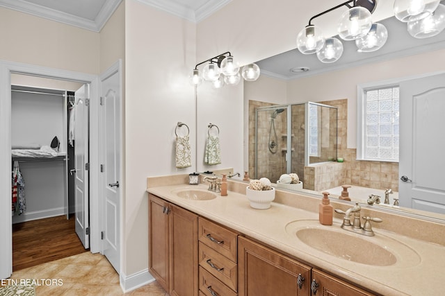 12618 Hunters Creek Ln, Knoxville, TN 37922 - bathroom featuring a shower stall, a spacious closet, crown molding, tile patterned flooring, and double vanity