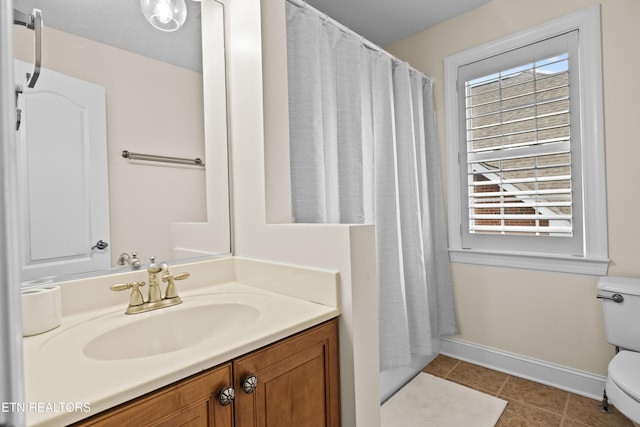 12618 Hunters Creek Ln, Knoxville, TN 37922 - full bathroom featuring toilet, healthy amount of natural light, baseboards, and tile patterned floors