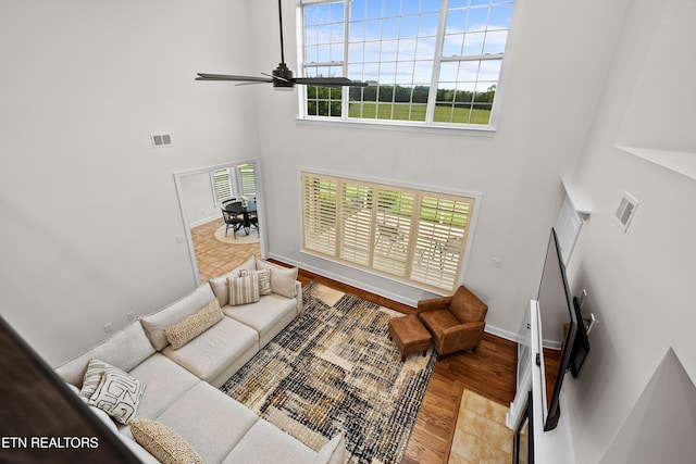 12618 Hunters Creek Ln, Knoxville, TN 37922 - living room featuring a high ceiling, wood finished floors, a ceiling fan, and baseboards