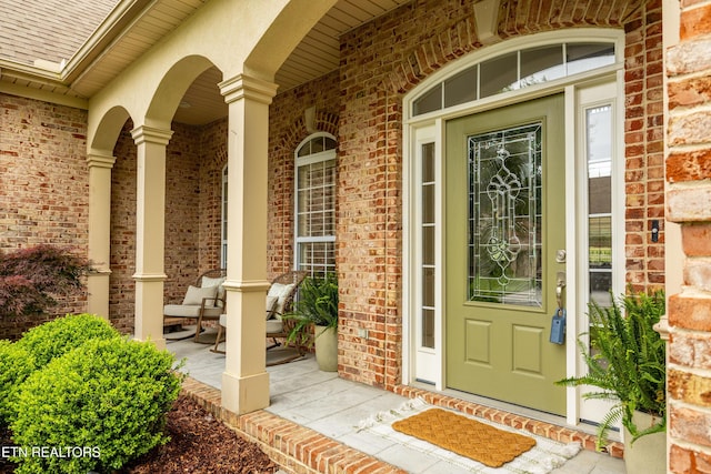 12618 Hunters Creek Ln, Knoxville, TN 37922 - doorway to property featuring a porch, brick siding, and a shingled roof
