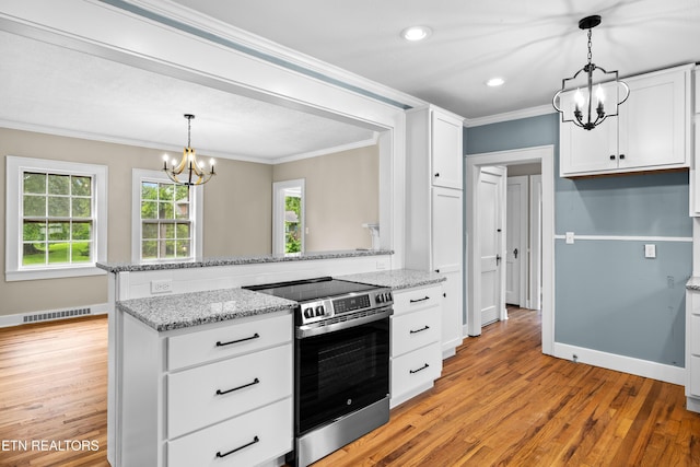 1210 Chilhowee Ave, Maryville, TN 37801 - kitchen with a chandelier, stainless steel electric stove, ornamental molding, light wood-type flooring, and recessed lighting