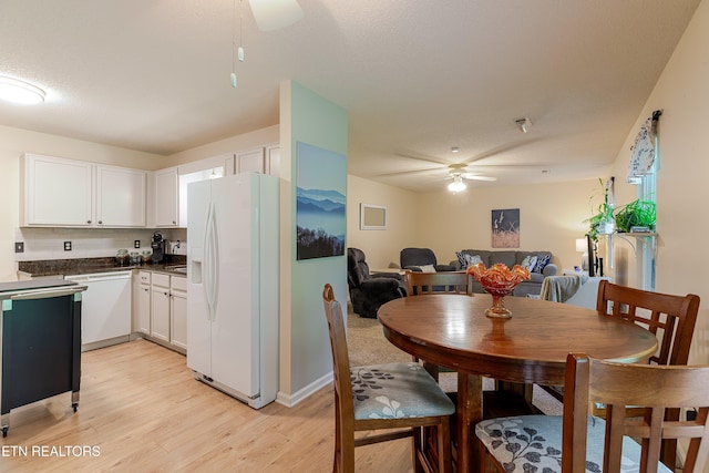 702 Shane Dr, Maryville, TN 37804 - kitchen with white appliances, ceiling fan, light wood-style flooring, and dark countertops