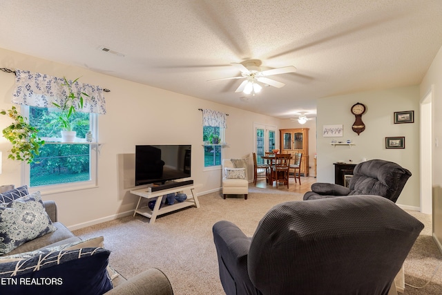 702 Shane Dr, Maryville, TN 37804 - living room featuring light colored carpet, a ceiling fan, a textured ceiling, and baseboards