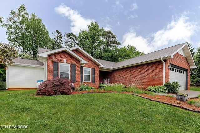 702 Shane Dr, Maryville, TN 37804 - ranch-style home featuring brick siding, an attached garage, a front yard, and a shingled roof