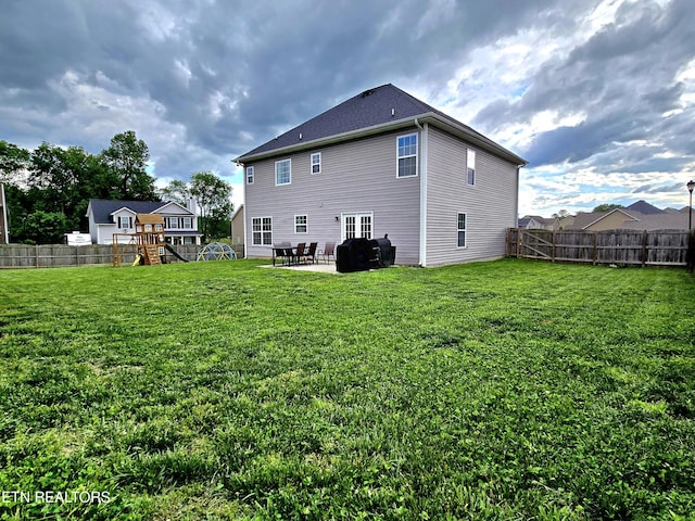 rear view of property with a patio area