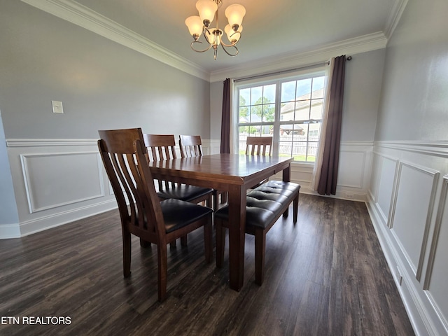 dining space featuring a chandelier, dark wood-style floors, a decorative wall, wainscoting, and crown molding