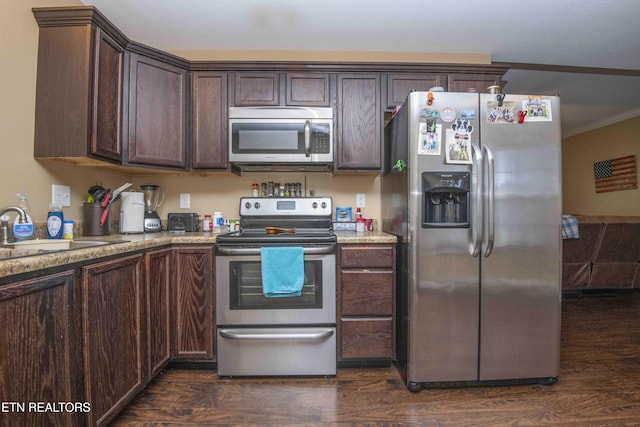 146 Prospect Rd, Maynardville, TN 37807 - kitchen featuring stainless steel appliances, dark brown cabinetry, a sink, ornamental molding, and dark wood-type flooring