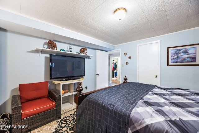bedroom featuring crown molding