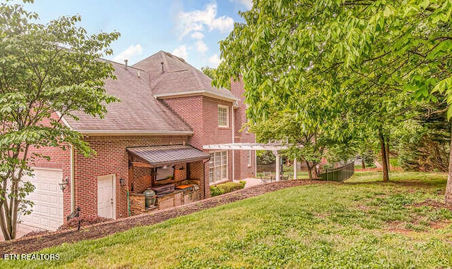 515 Oak Landing Ln Unit 4, Knoxville, TN 37934 - back of house featuring brick siding, a yard, a garage, and a shingled roof