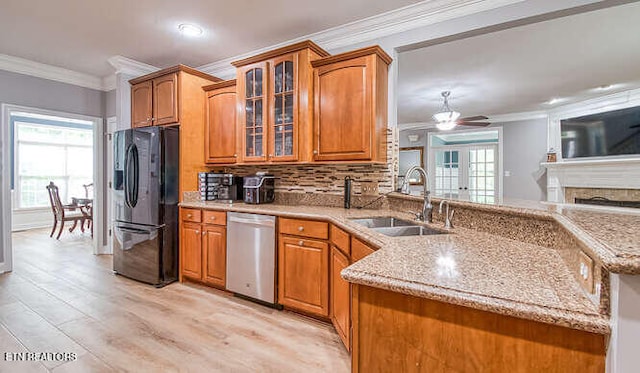 515 Oak Landing Ln Unit 4, Knoxville, TN 37934 - kitchen featuring freestanding refrigerator, stainless steel dishwasher, ornamental molding, a sink, and brown cabinets