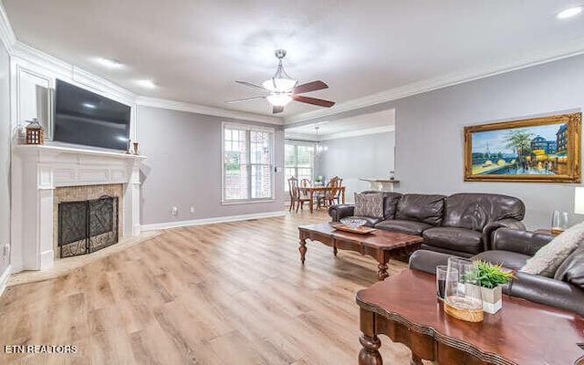 515 Oak Landing Ln Unit 4, Knoxville, TN 37934 - living area featuring ornamental molding, a ceiling fan, wood finished floors, a fireplace with flush hearth, and baseboards