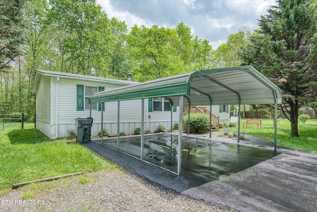 view of car parking featuring driveway and a detached carport