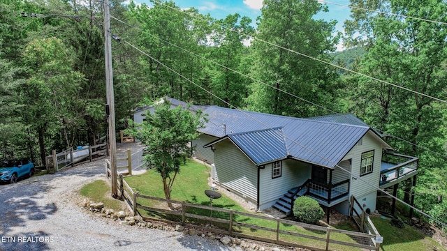 view of subject property with a forest