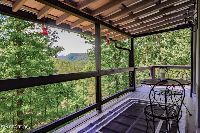 wooden deck with a mountain view