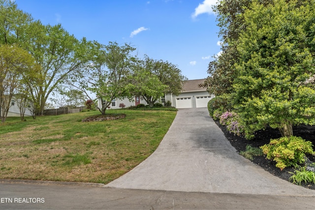 9945 Tierra Verde Dr, Knoxville, TN 37922 - view of property hidden behind natural elements featuring a garage and concrete driveway