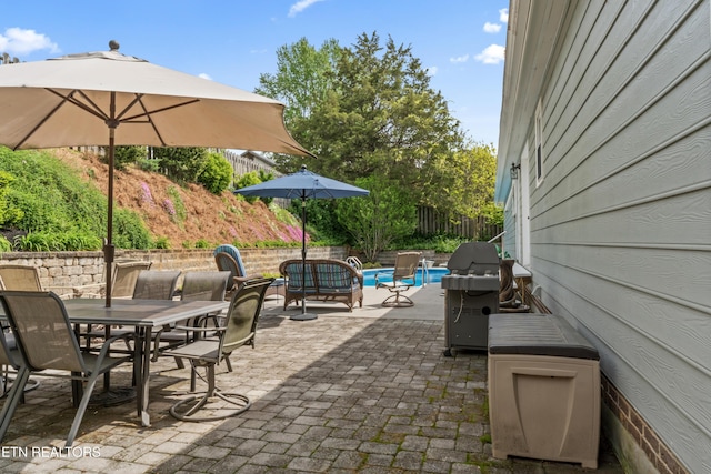 9945 Tierra Verde Dr, Knoxville, TN 37922 - view of patio featuring outdoor dining space, grilling area, and fence
