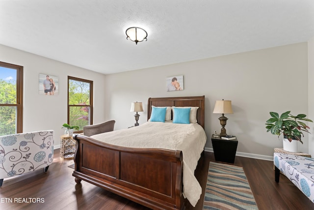 9945 Tierra Verde Dr, Knoxville, TN 37922 - bedroom with multiple windows, dark wood-style floors, and baseboards