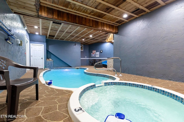 view of pool featuring a pool with connected hot tub