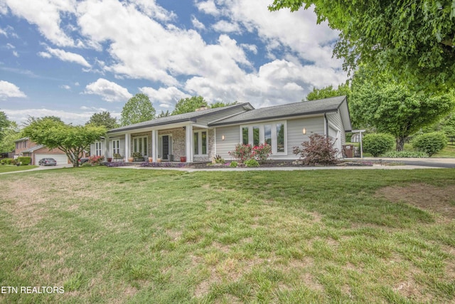 409 Celebration Rd, Knoxville, TN 37934 - ranch-style house featuring a front lawn, a porch, and stone siding