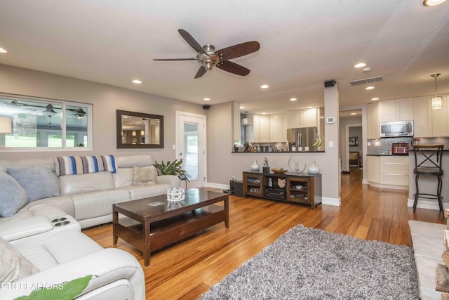409 Celebration Rd, Knoxville, TN 37934 - living room with ceiling fan, light wood-type flooring, recessed lighting, and baseboards