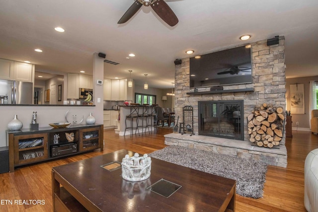 409 Celebration Rd, Knoxville, TN 37934 - living room featuring ceiling fan, wood finished floors, baseboards, a fireplace, and recessed lighting