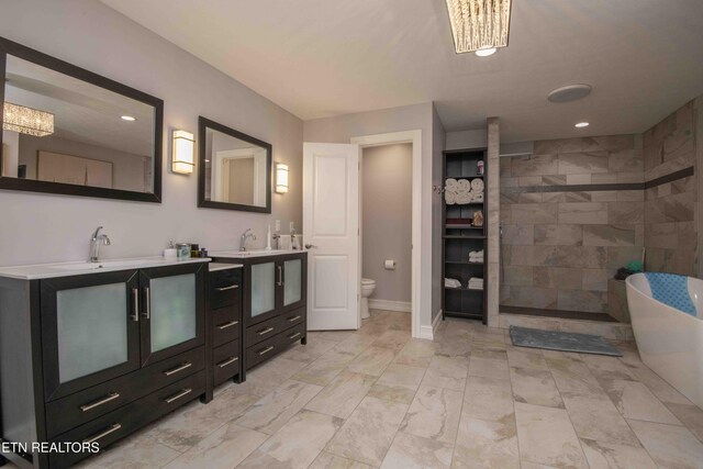 409 Celebration Rd, Knoxville, TN 37934 - full bath with walk in shower, toilet, vanity, recessed lighting, and a freestanding bath