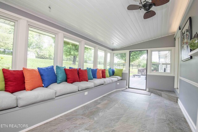 409 Celebration Rd, Knoxville, TN 37934 - sunroom / solarium featuring lofted ceiling, a ceiling fan, an outdoor living space, baseboards, and stone finish floors