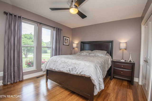 409 Celebration Rd, Knoxville, TN 37934 - bedroom with baseboards, wood finished floors, and a ceiling fan