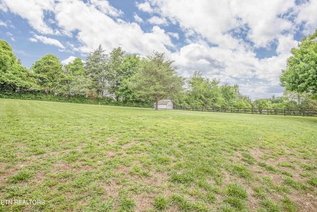 409 Celebration Rd, Knoxville, TN 37934 - view of yard featuring a shed, an outbuilding, and a view of countryside