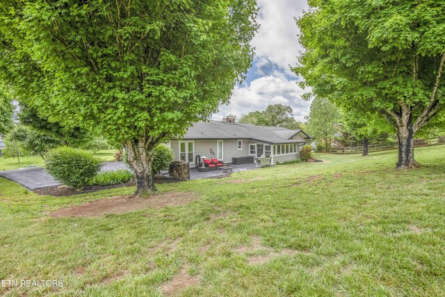 409 Celebration Rd, Knoxville, TN 37934 - view of grassy yard featuring a patio area