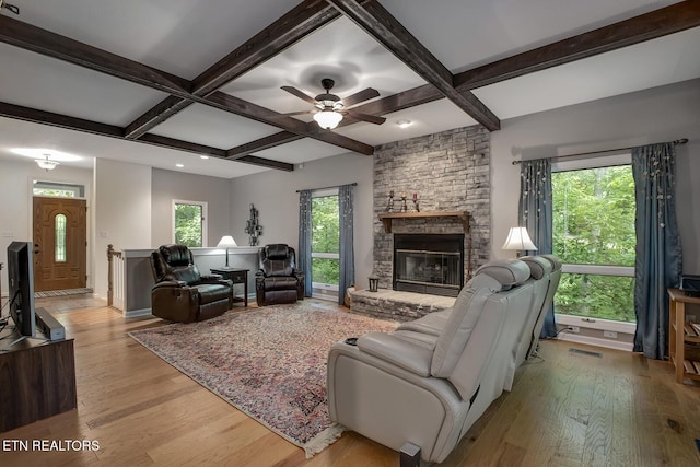 401 Shawnee Pl, Loudon, TN 37774 - living room featuring wood finished floors, coffered ceiling, a stone fireplace, beamed ceiling, and ceiling fan