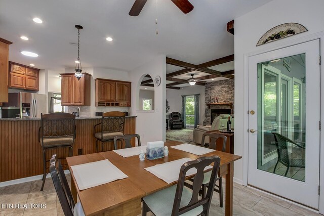 401 Shawnee Pl, Loudon, TN 37774 - dining room with a ceiling fan, coffered ceiling, a stone fireplace, recessed lighting, and beam ceiling
