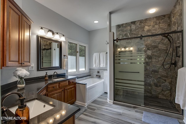 401 Shawnee Pl, Loudon, TN 37774 - full bath with a garden tub, a shower stall, vanity, recessed lighting, and wood finished floors