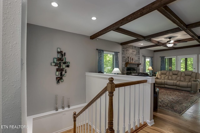 401 Shawnee Pl, Loudon, TN 37774 - stairway featuring a stone fireplace, wood finished floors, a ceiling fan, beamed ceiling, and recessed lighting