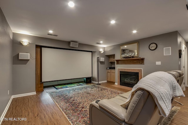 401 Shawnee Pl, Loudon, TN 37774 - home theater with baseboards, wood finished floors, a fireplace, and recessed lighting