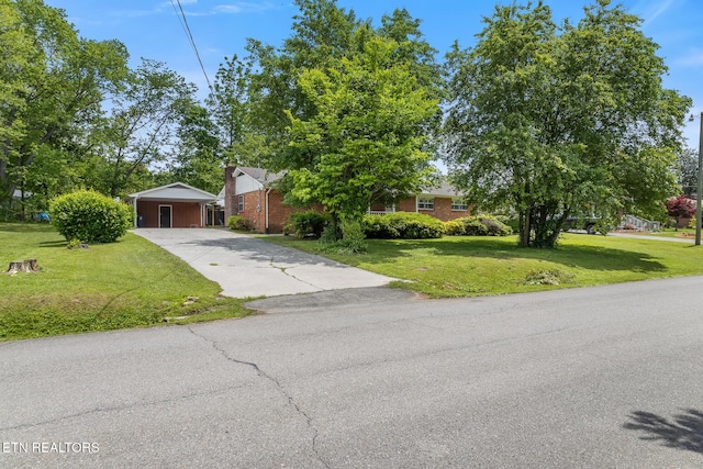 513 Long Mill Rd, Athens, TN 37303 - obstructed view of property with driveway, a front lawn, brick siding, and a carport