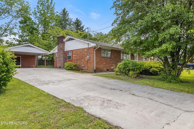 513 Long Mill Rd, Athens, TN 37303 - view of side of property with crawl space, brick siding, concrete driveway, a yard, and a chimney