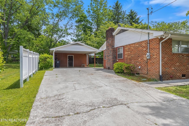 513 Long Mill Rd, Athens, TN 37303 - view of property exterior with concrete driveway, brick siding, and a chimney