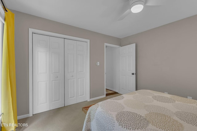 bedroom featuring carpet flooring, a closet, a ceiling fan, and baseboards