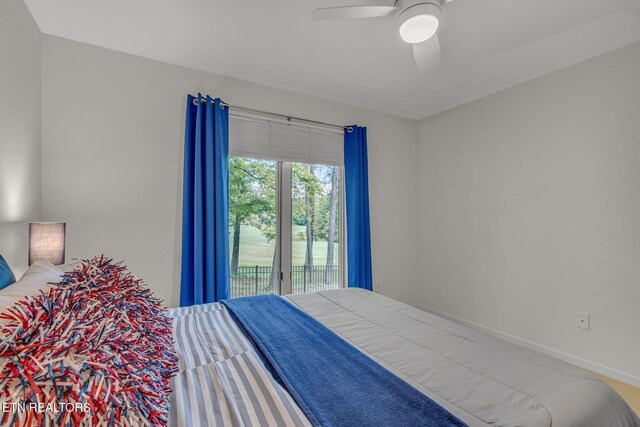 bedroom with access to outside, a ceiling fan, and baseboards