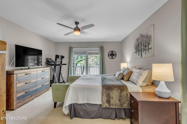 carpeted bedroom featuring access to outside and a ceiling fan