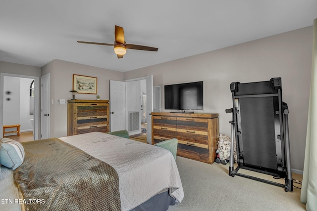 bedroom with light colored carpet, a ceiling fan, and baseboards