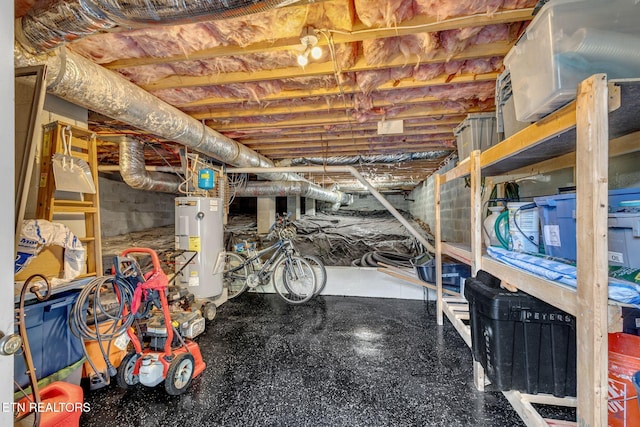 unfinished basement featuring water heater