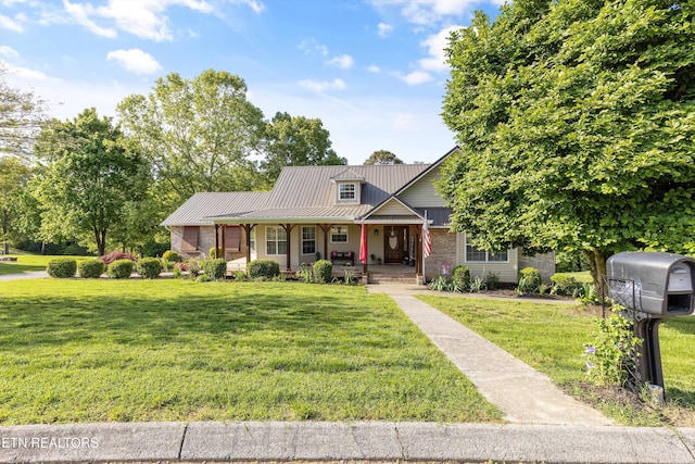 3083 Waters Edge Dr, Morristown, TN 37814 - view of front of home featuring covered porch, a front lawn, a standing seam roof, and metal roof