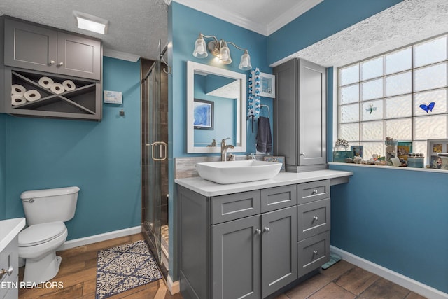 3083 Waters Edge Dr, Morristown, TN 37814 - bathroom with crown molding, vanity, toilet, a stall shower, and wood finished floors