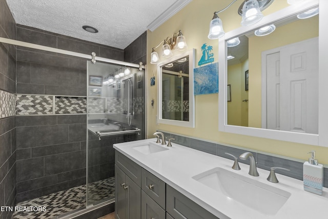 3083 Waters Edge Dr, Morristown, TN 37814 - bathroom with a shower stall, double vanity, and a textured ceiling