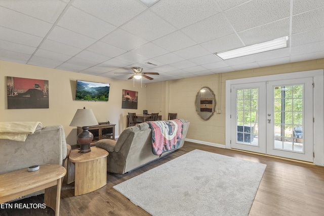 3083 Waters Edge Dr, Morristown, TN 37814 - living area featuring a drop ceiling, dark wood finished floors, ceiling fan, french doors, and baseboards