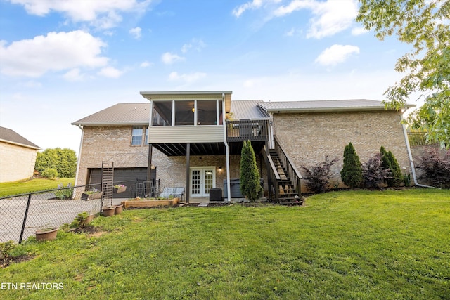3083 Waters Edge Dr, Morristown, TN 37814 - back of property with brick siding, a sunroom, stairway, french doors, and an attached garage