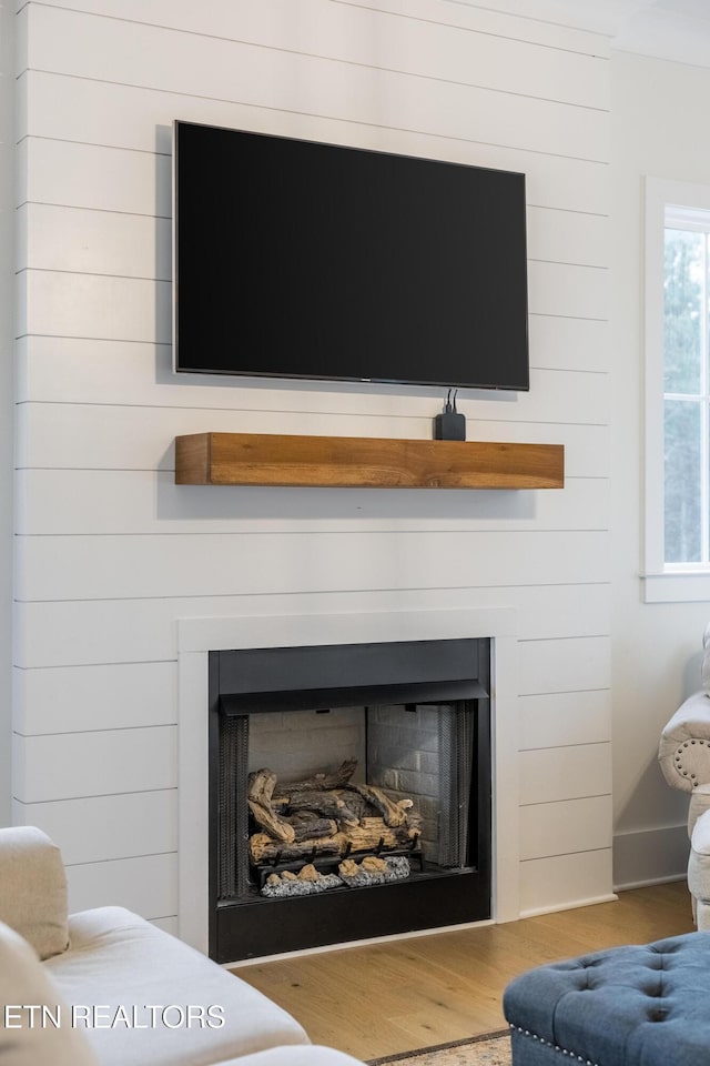 819 NW Morgan Rd, Charleston, TN 37310 - detailed view of a fireplace and wood finished floors
